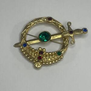 brooch pin women's costume jewelry gold tone sword-looking English pin.